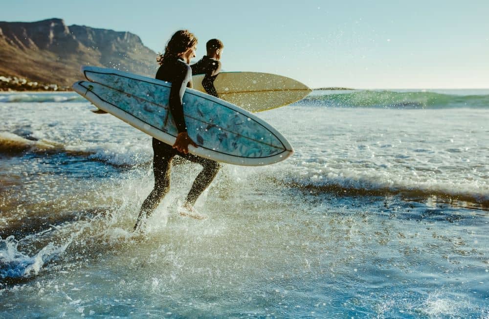 Young surfers on the beach.