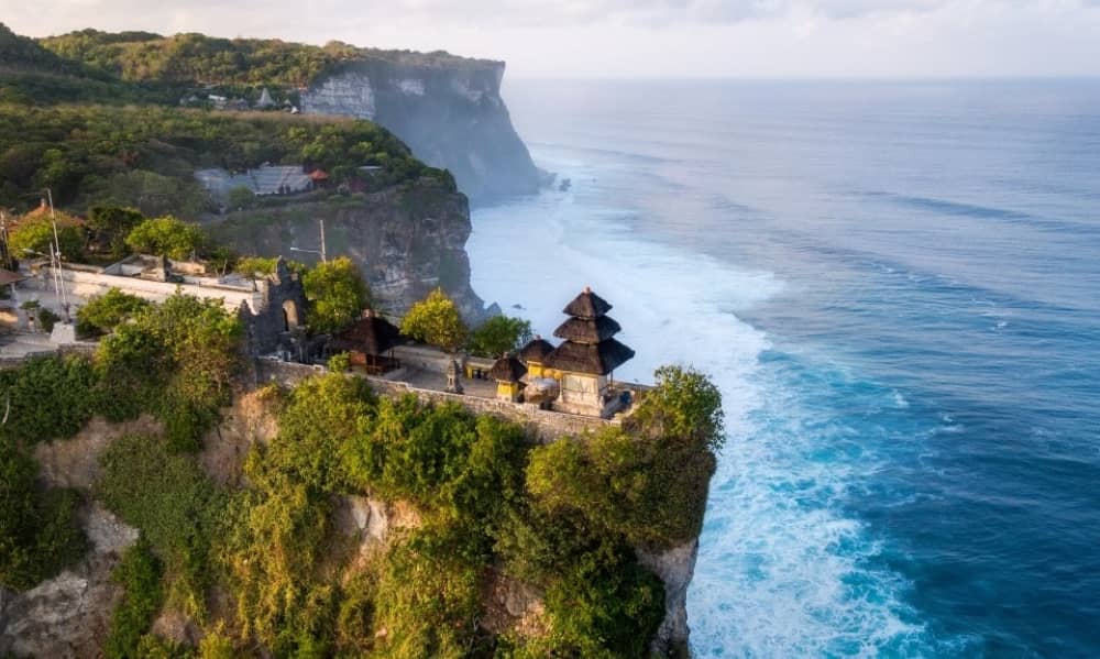 Uluwatu Temple is a famous ancient sea temple built on the tip of a cliff.