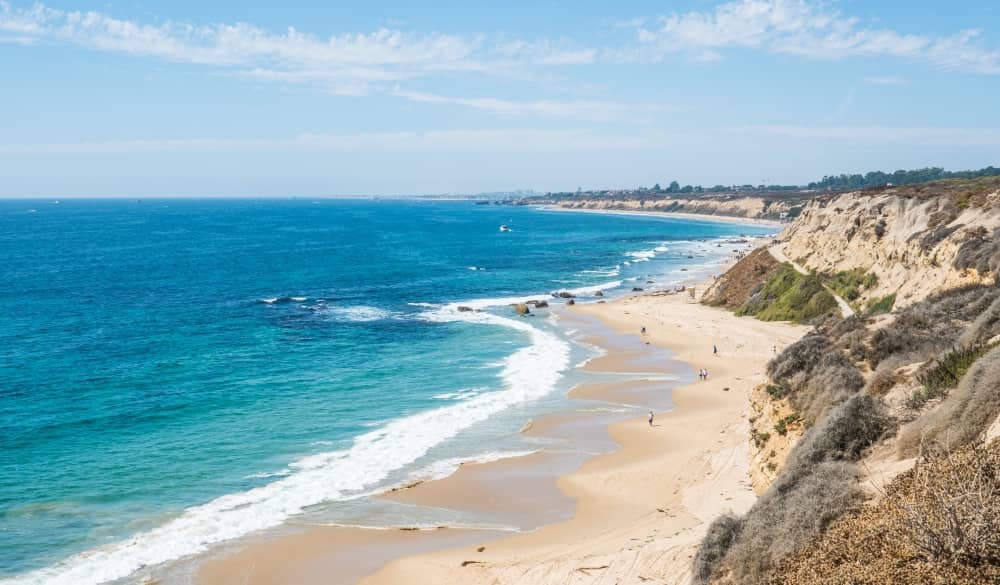 Newport beach in Orange County is a sheltered beach break that has pretty consitent surf and can work at any time of the year.