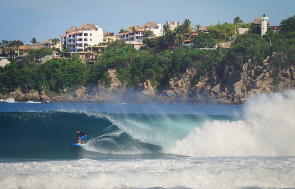 Puerto Escondido draws surfers of all levels with its serene beaches and large waves.